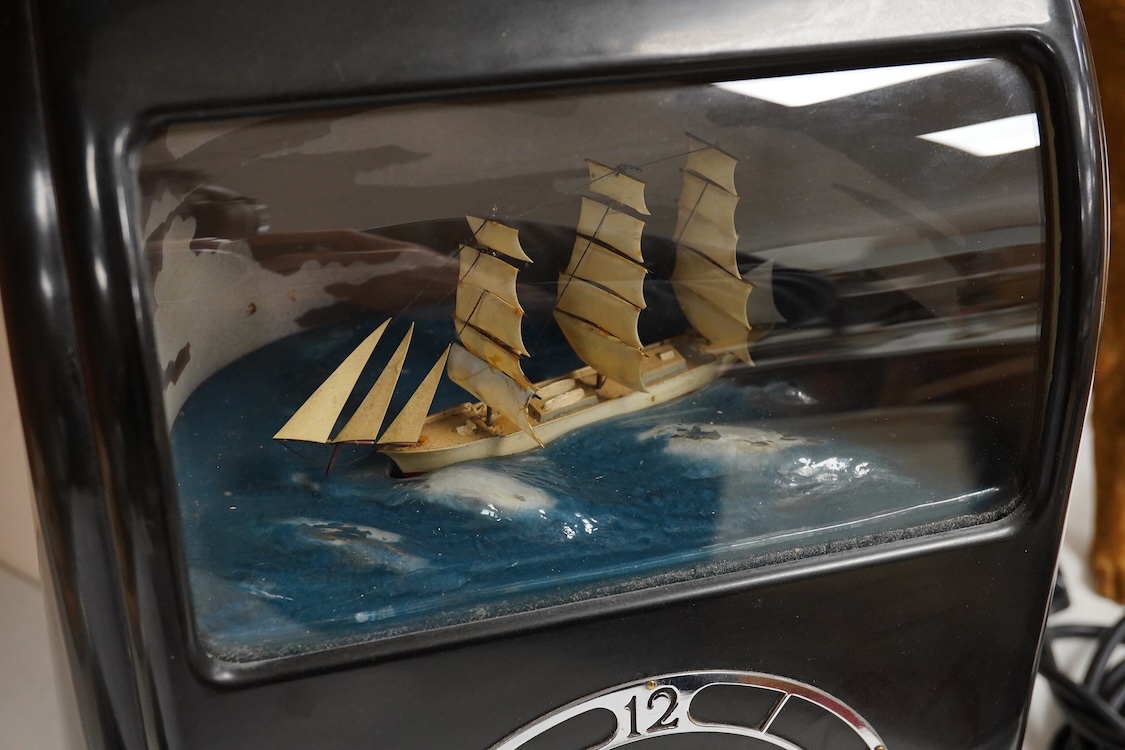 A 1930s ‘Vitascope’ black bakelite clock, 33cm high